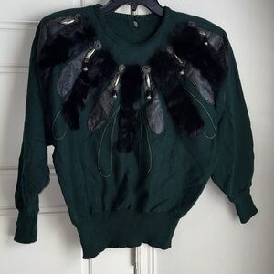 Elegant Green Sweater with Black Feather Accents